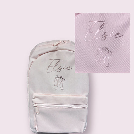 Light gray backpack with 'Elsie' and ballet shoe design, alongside a matching pink card.