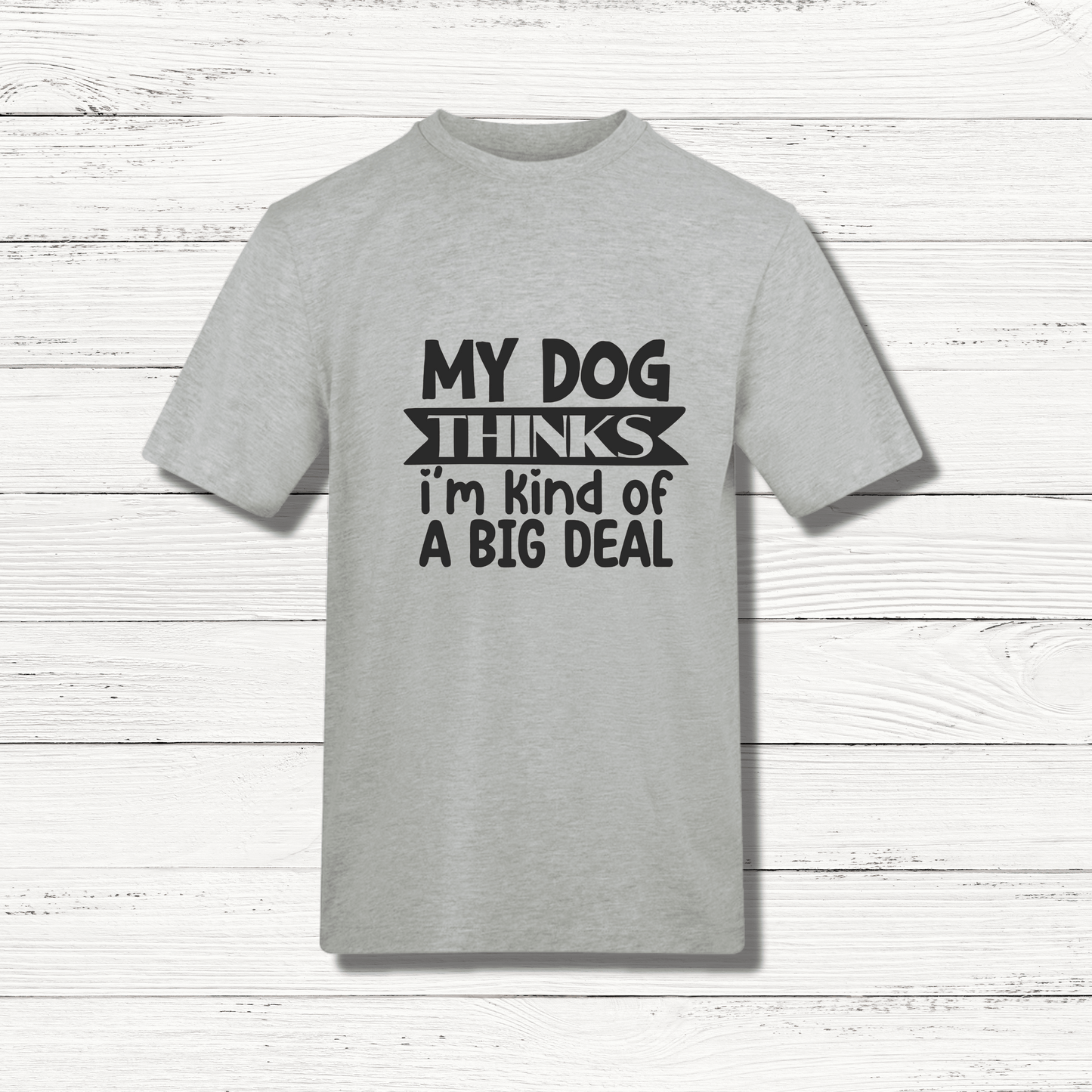 Gray t-shirt with black text on a wooden surface