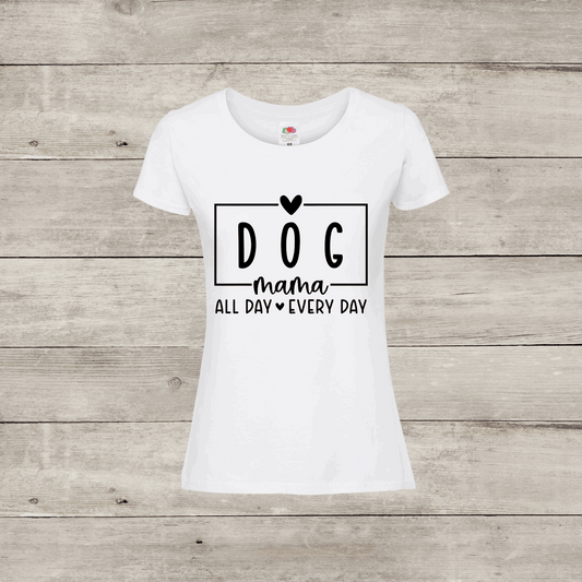 White t-shirt with 'DOG mama ALL DAY EVERY DAY' text on a wooden surface
