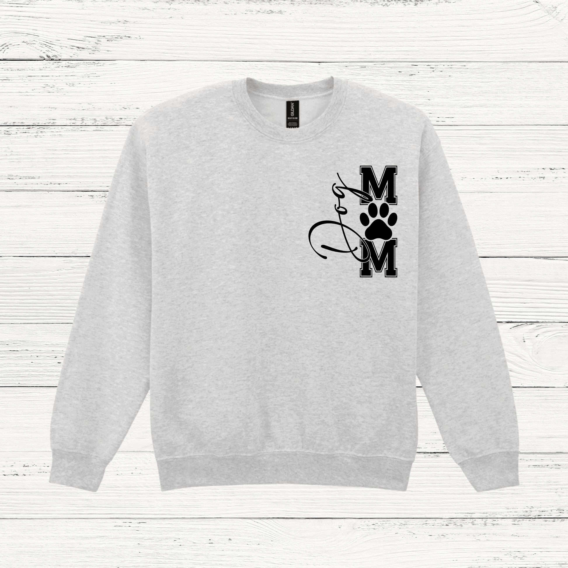 Gray sweatshirt with a black graphic design on a white wooden background