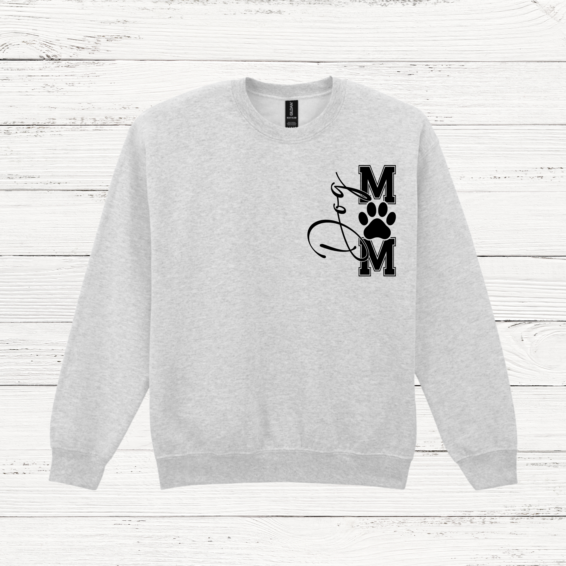 Gray sweatshirt with a black graphic design on a white wooden background