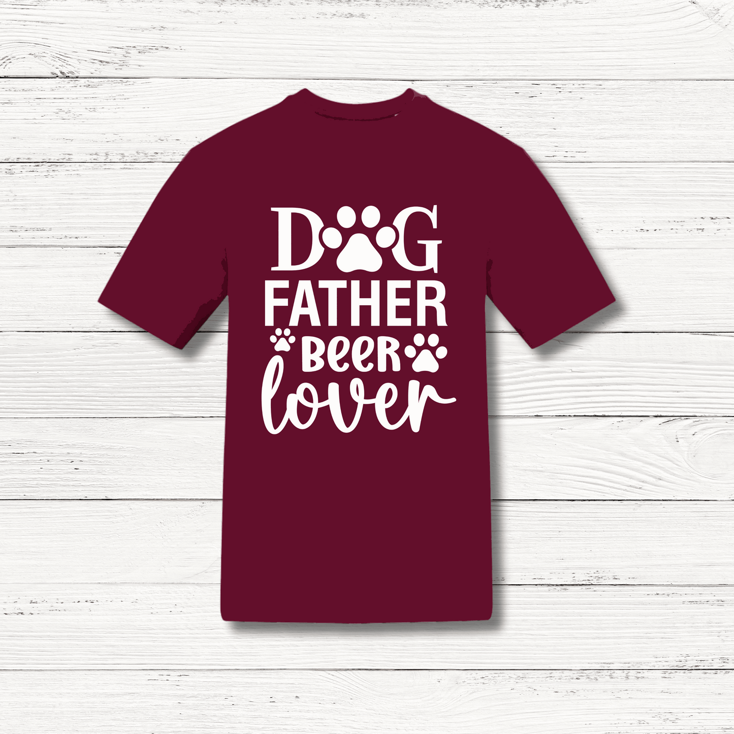 Maroon t-shirt with 'Dog Father Beer Lover' text on a wooden surface