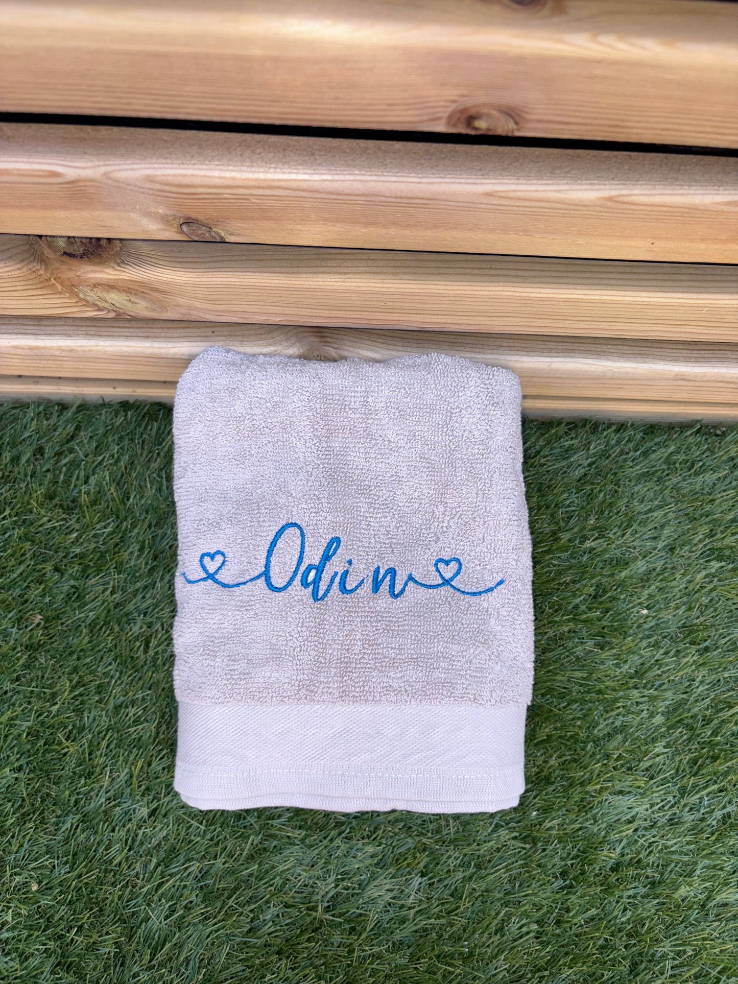 Light grey towel with Odin embroidered 