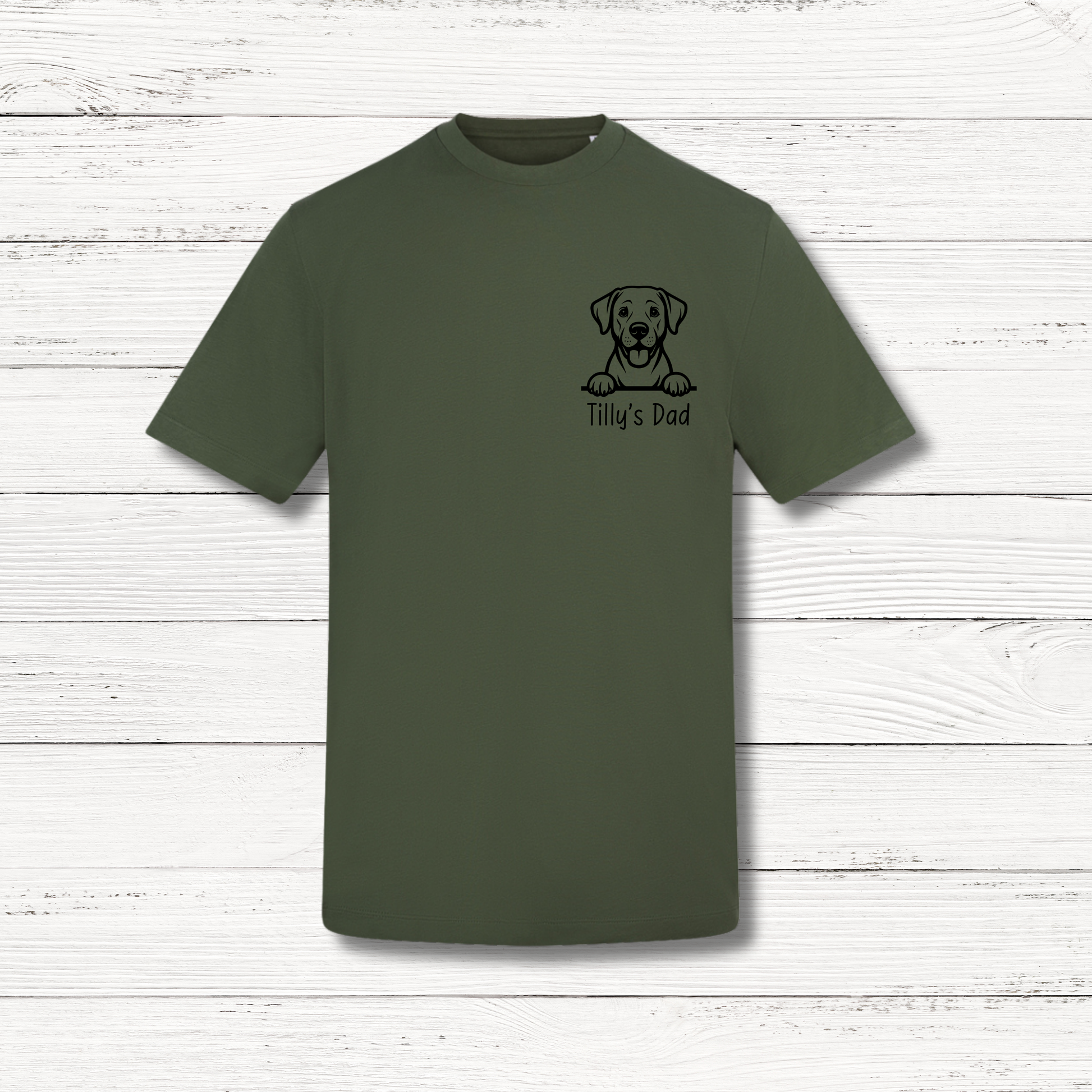 Green t-shirt with a dog graphic and text on a white wooden background