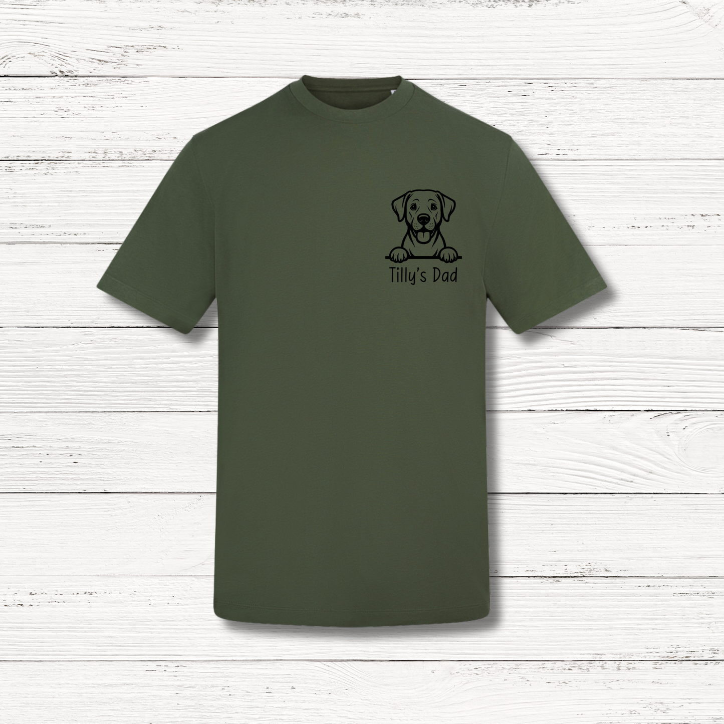 Green t-shirt with a dog graphic and text on a white wooden background