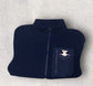 Navy blue fleece jacket with a pocket on a light gray background