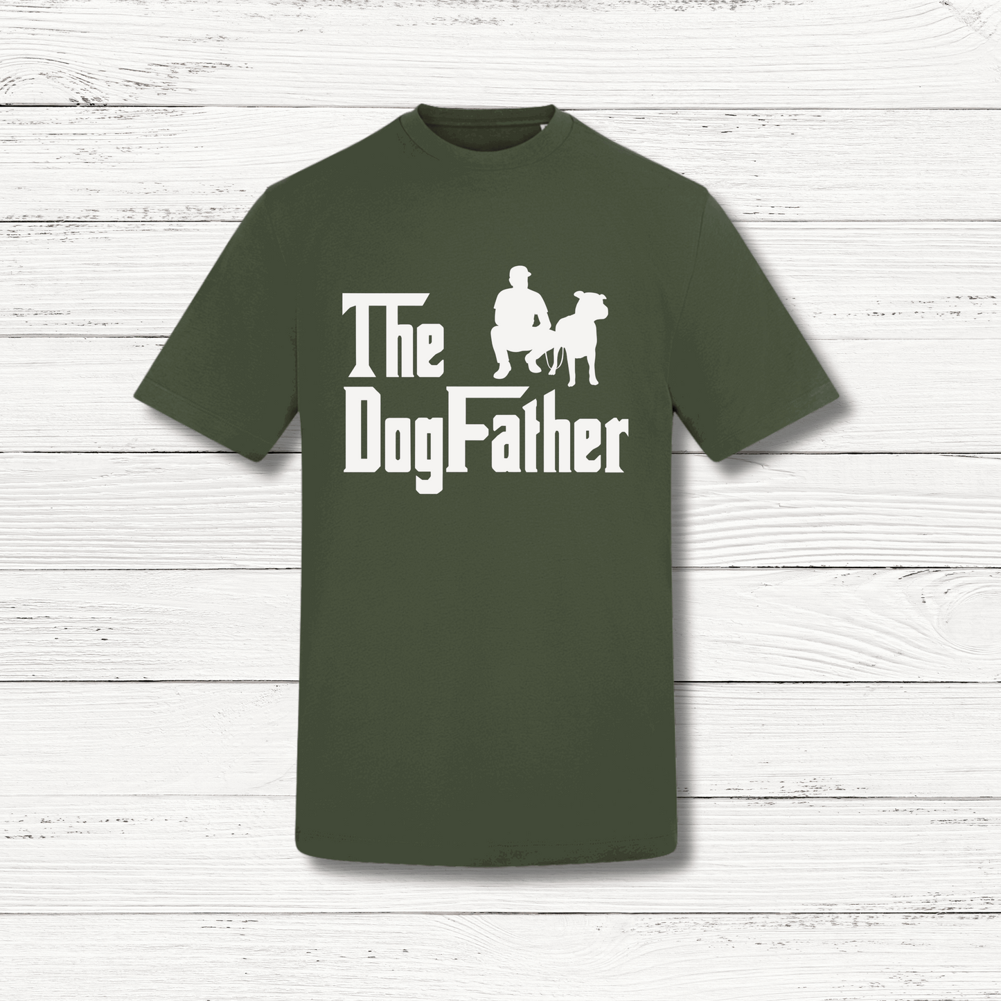 Green t-shirt with 'The Dog Father' text and graphic on a wooden surface