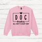 Pink sweatshirt with 'DOG mama ALL DAY EVERY DAY' text on a wooden surface
