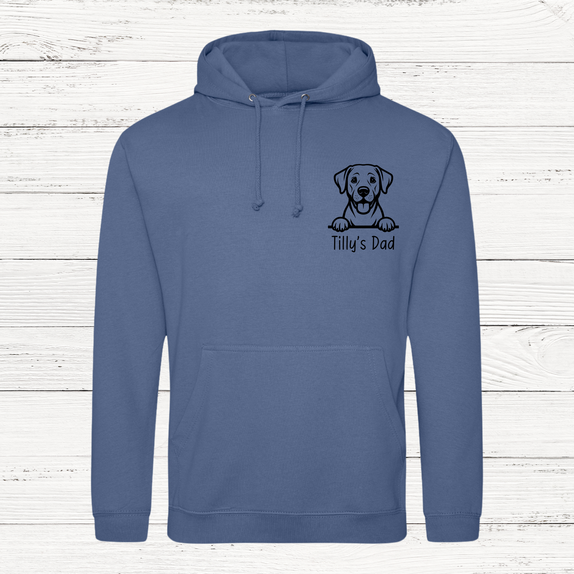 Blue hoodie with a dog illustration and text on a wooden background
