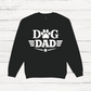 Black sweatshirt with 'Dog Dad' text on a white wooden background