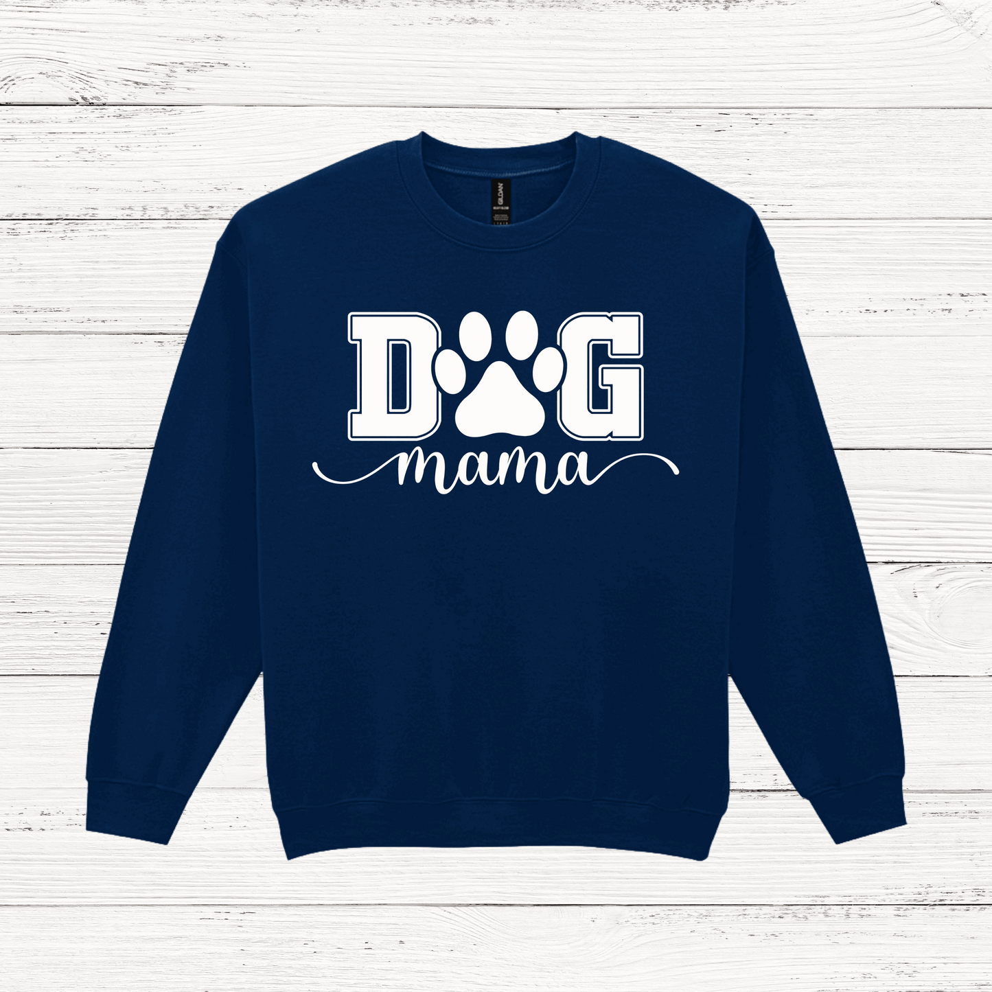Navy blue sweatshirt with 'DOG mama' text and paw print on a white wooden background