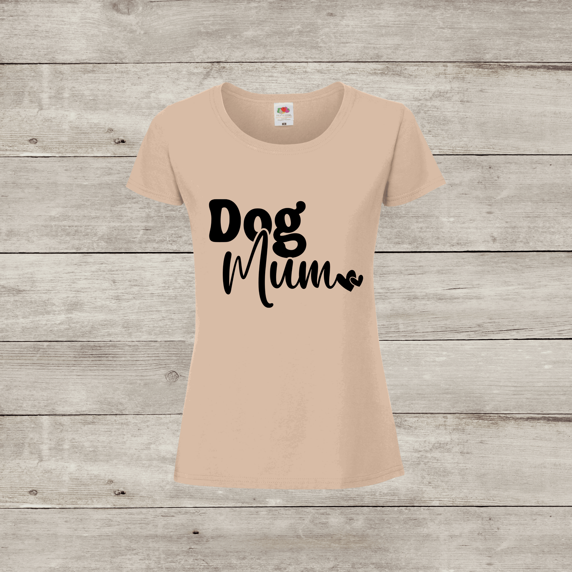 Beige t-shirt with 'Dog Mum' text on a wooden surface