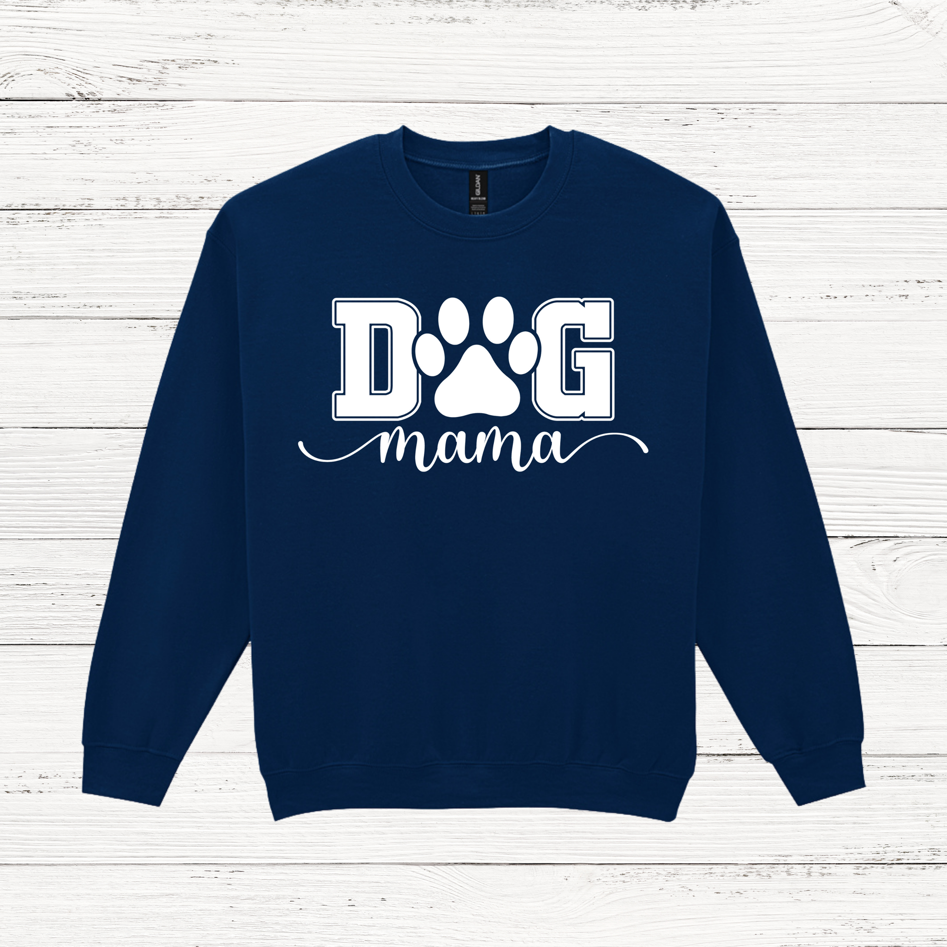 Navy blue sweatshirt with 'DOG mama' text and paw print on a white wooden background
