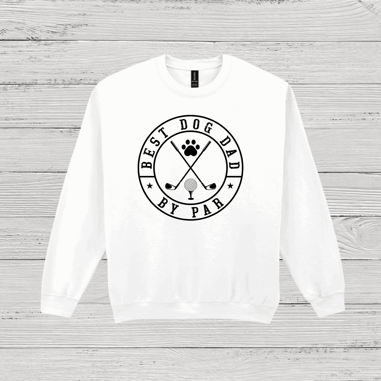 White sweatshirt with 'Best Dog Dad by Par' text on a wooden surface