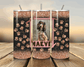 Three glittery tumblers with paw patterns and a photo of a dog named Maeve on a wooden surface.