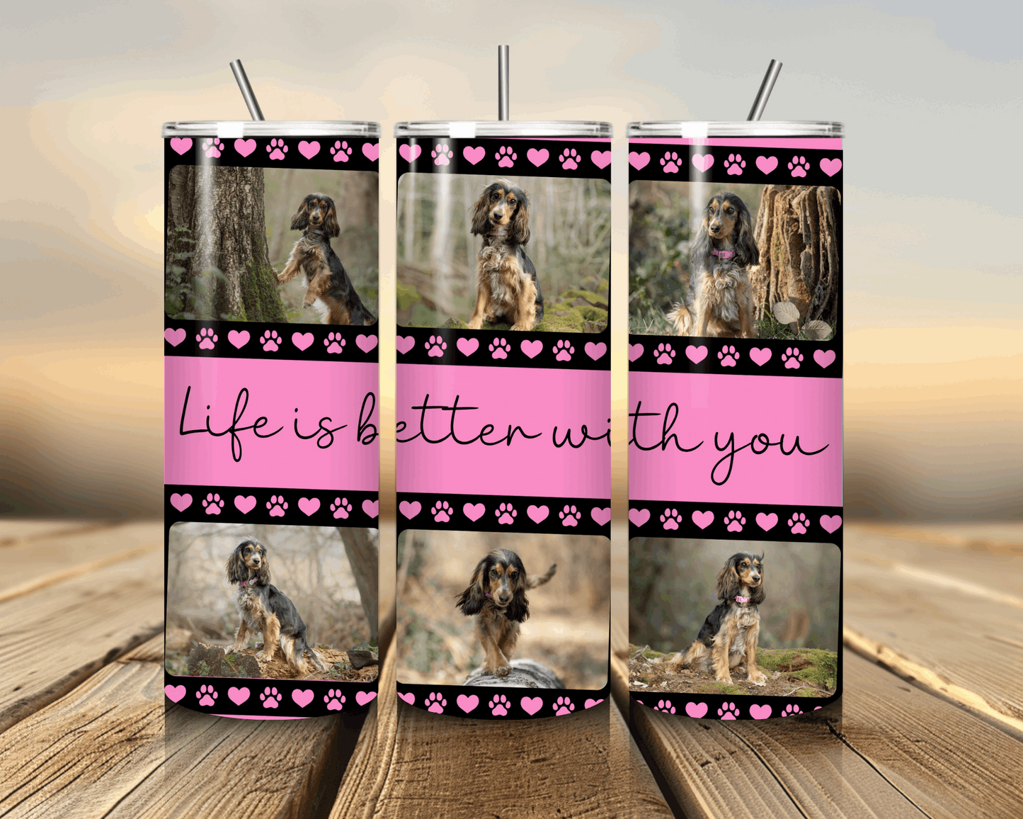 A tumbler with a dog photo and 'Life is better with you' text on a wooden surface.