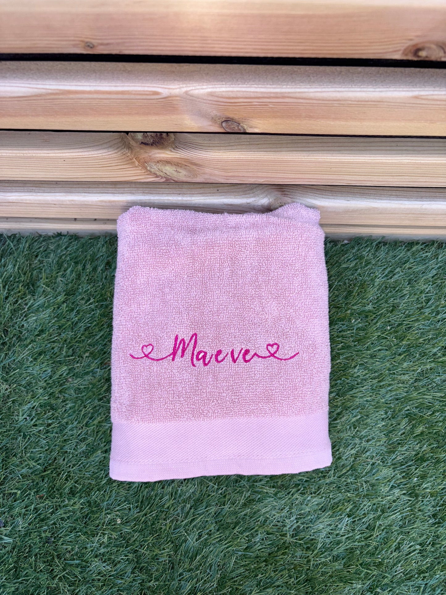 Light pink towel with Maeve embroidered 