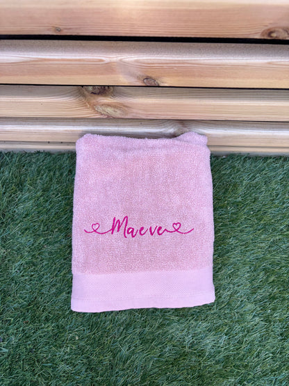 Light pink towel with Maeve embroidered 