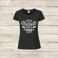 Black t-shirt with 'Life is better with a dog' text on a wooden background