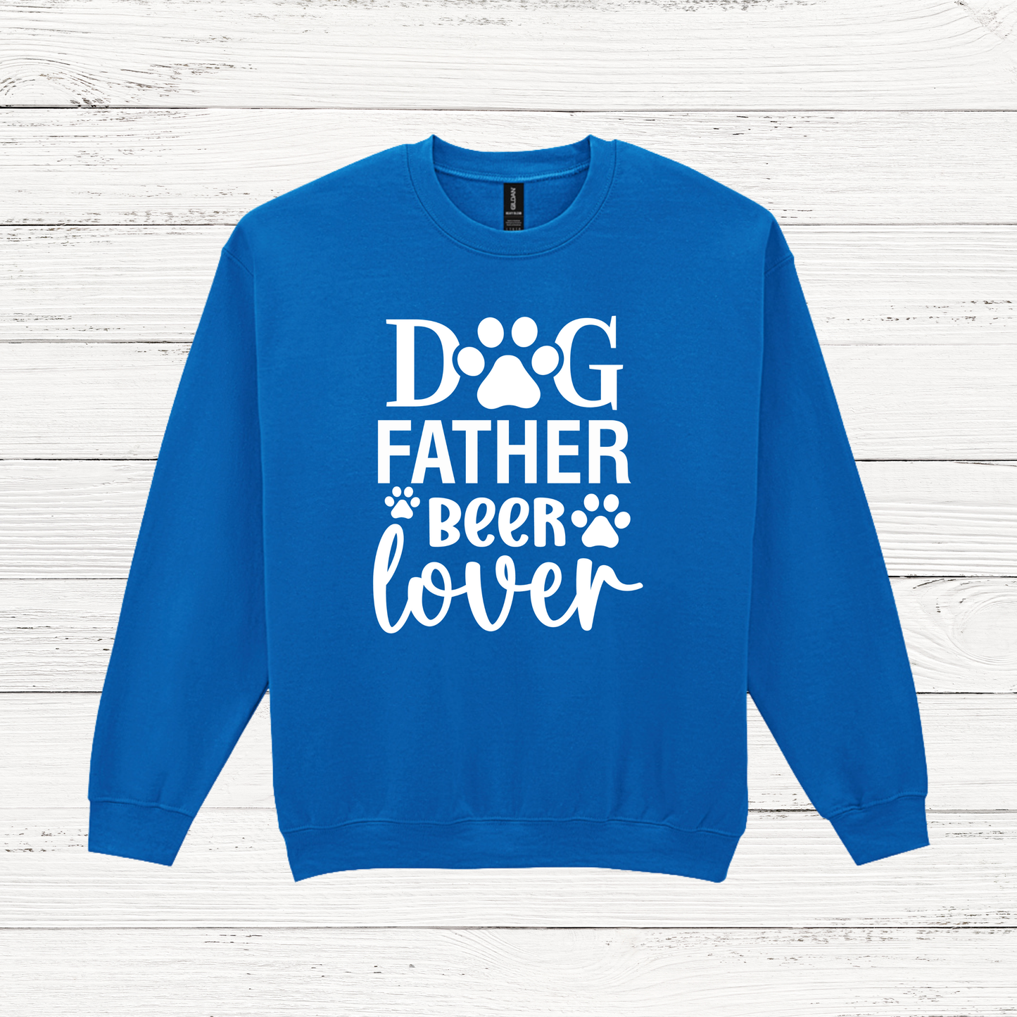 Blue sweatshirt with 'Dog Father Beer Lover' text on a wooden background