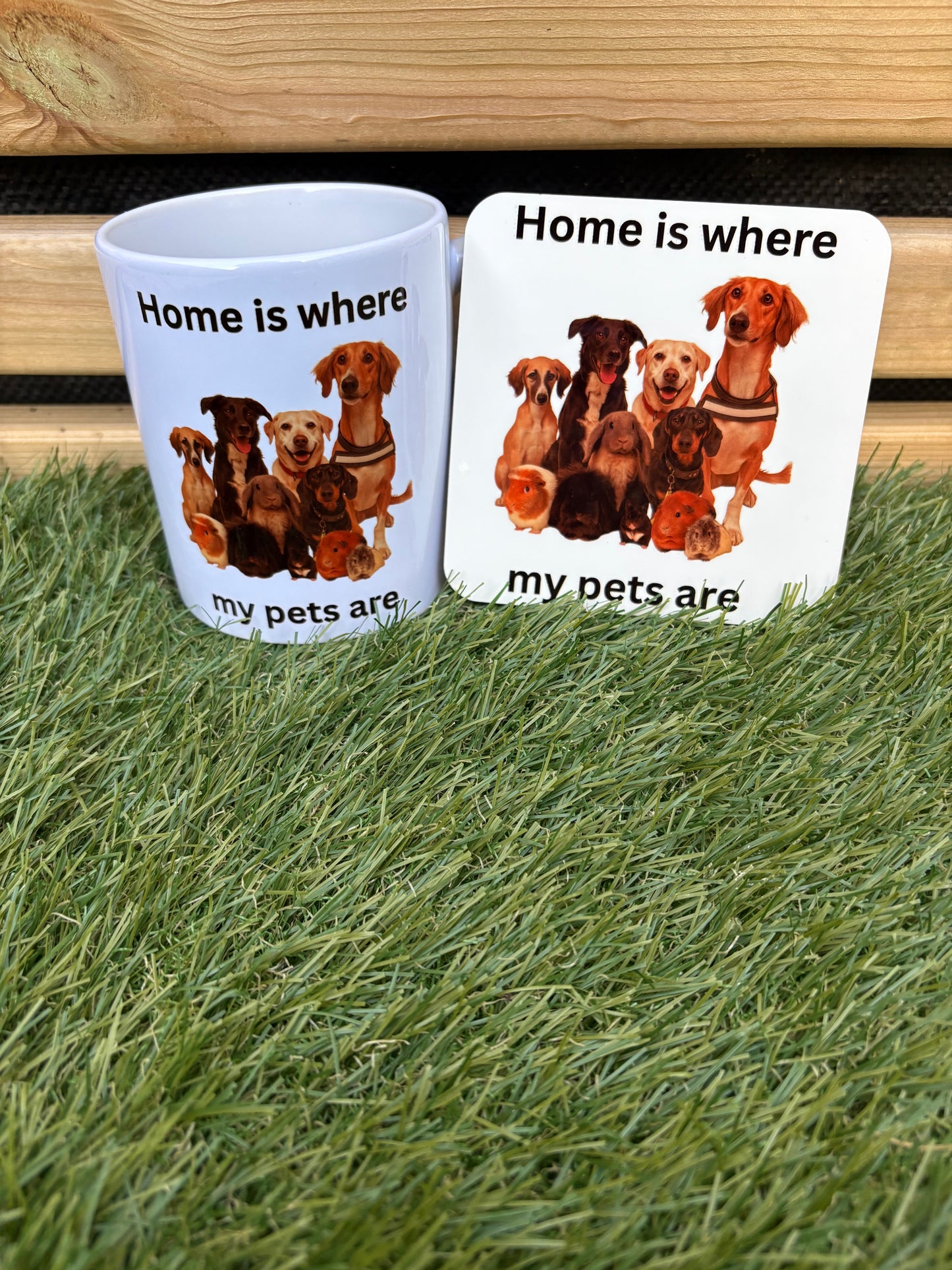 Two coasters with dog illustrations and text on a grassy background