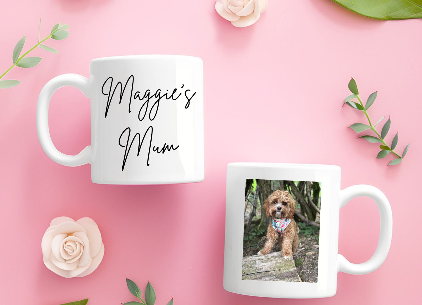 Two mugs on a pink background with one displaying 'Maggie's Mum' and the other featuring a dog photo.