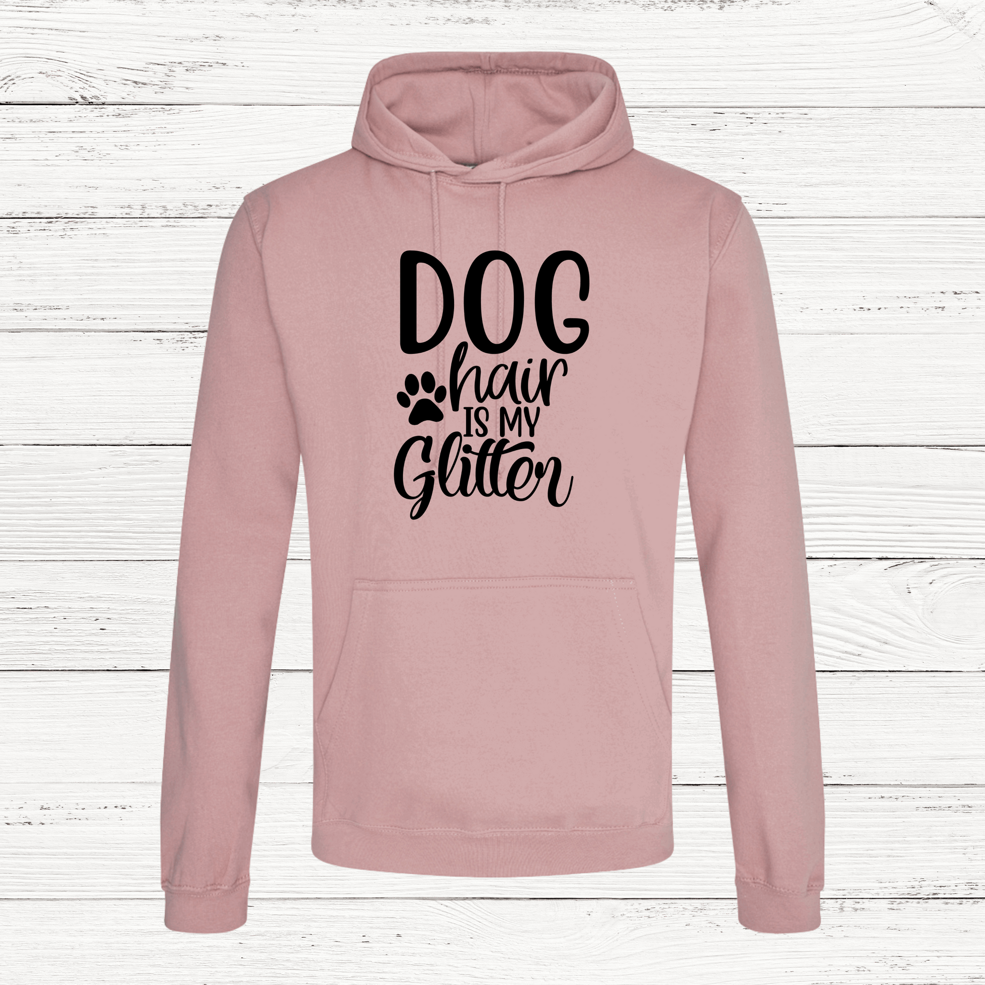 Pink hoodie with 'Dog hair is my Glitter' text on a wooden background