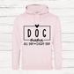 Pink hoodie with 'DOG mama all day every day' text on a wooden background