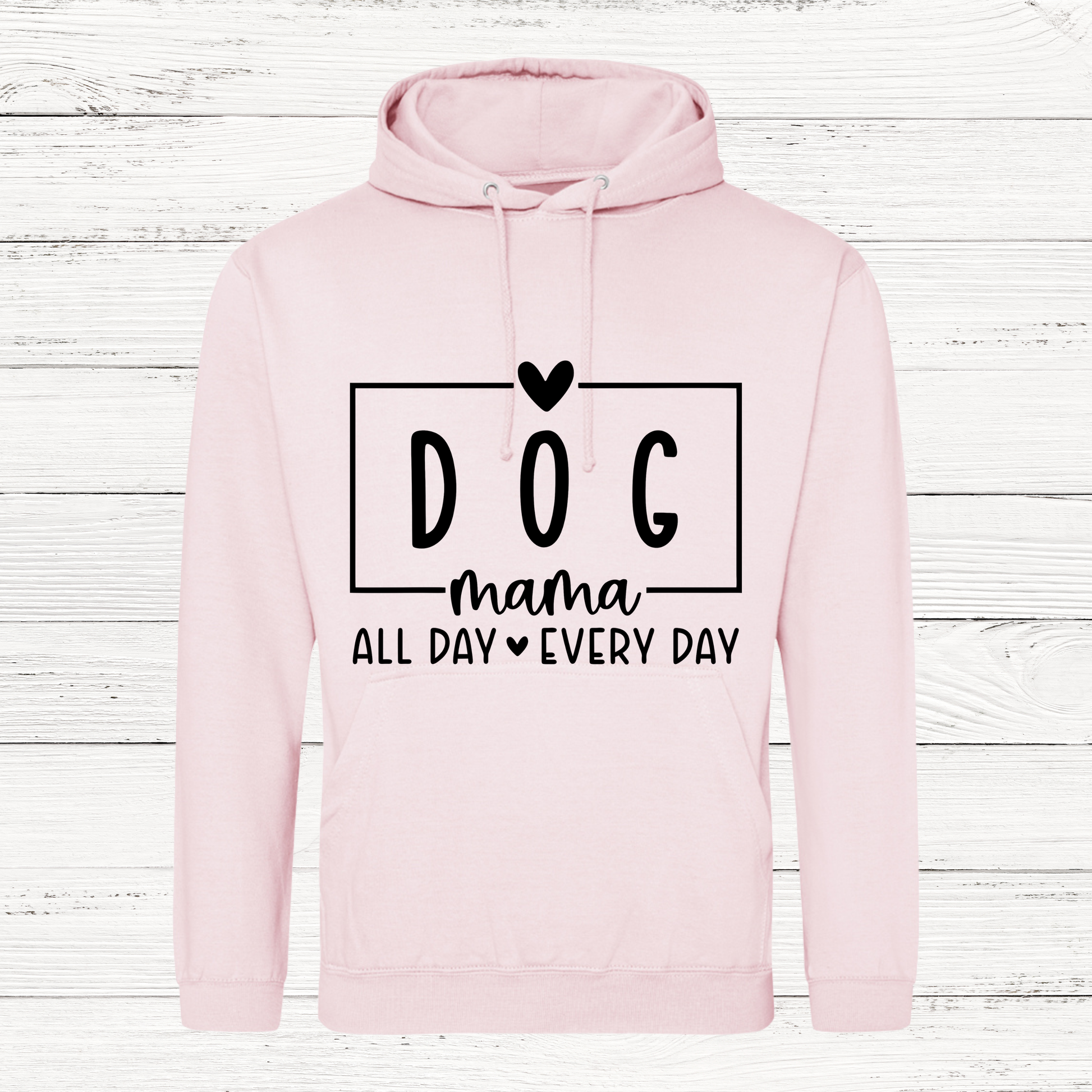 Pink hoodie with 'DOG mama all day every day' text on a wooden background