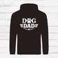 Black hoodie with 'Dog Dad' text on a white wooden background