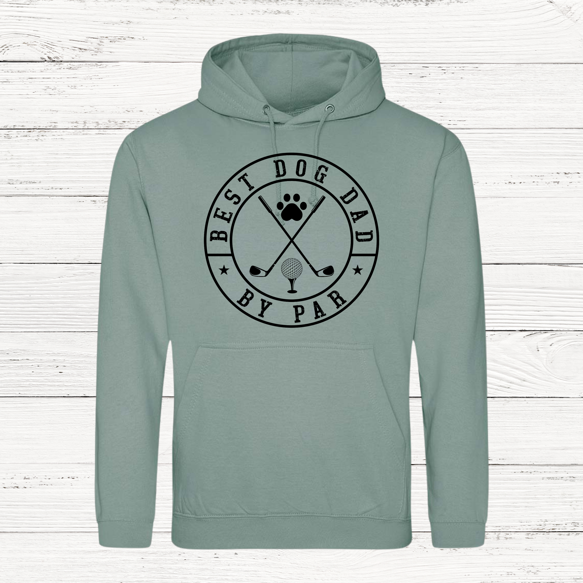 Sage green hoodie with 'Best Dog Dad by Par' text and graphics on a white wooden background