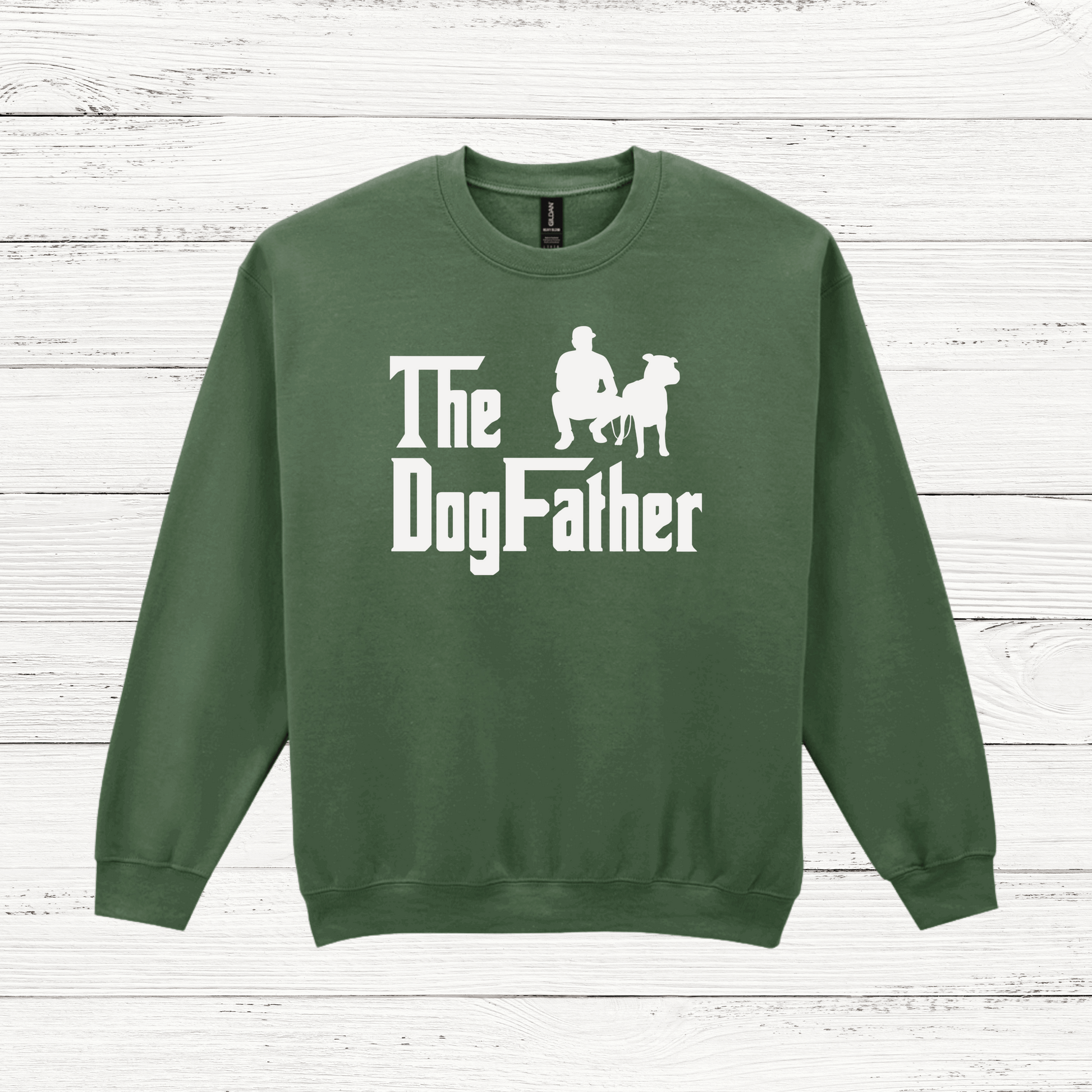 Green sweatshirt with 'The Dog Father' text and graphic on a wooden surface