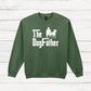 Green sweatshirt with 'The Dog Father' text and graphic on a wooden surface