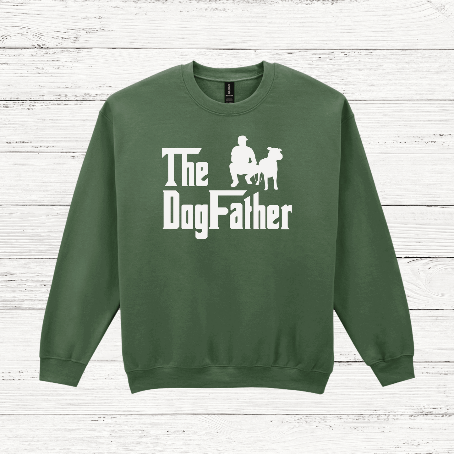 Green sweatshirt with 'The Dog Father' text and graphic on a wooden surface