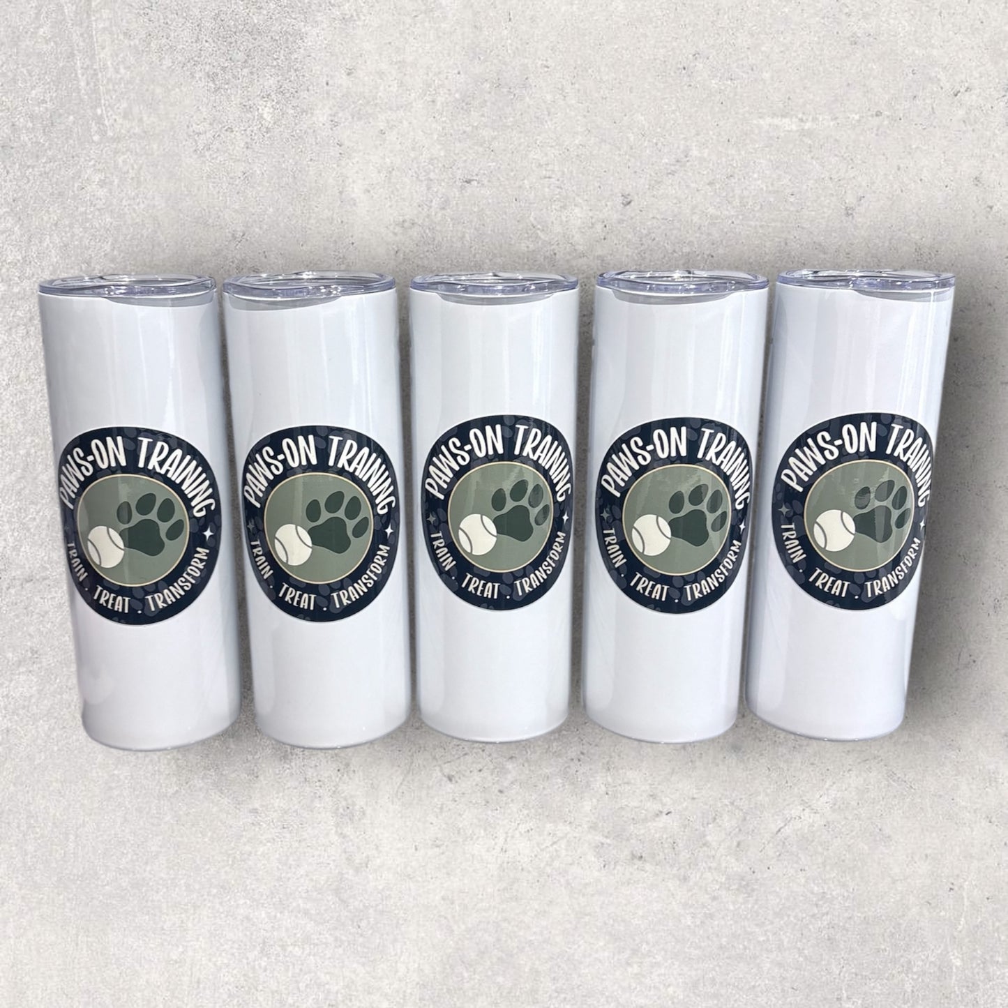 Five personalised business tumblers with Paws on Training logo